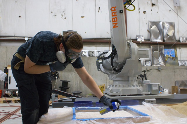 Brenna spraying sand